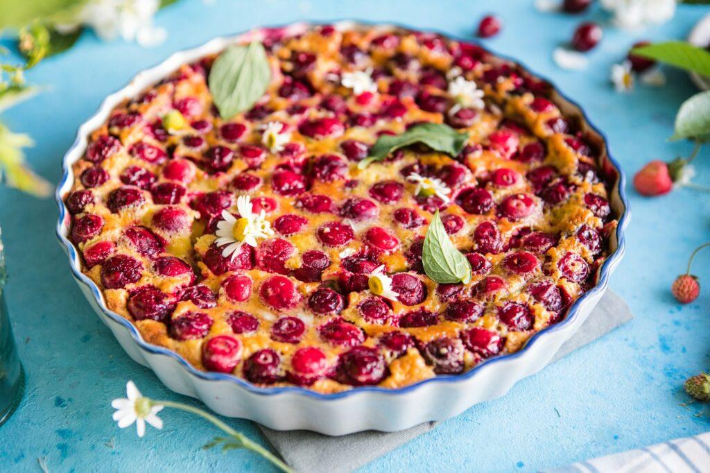 cherry Clafoutis with cherry on a blue background