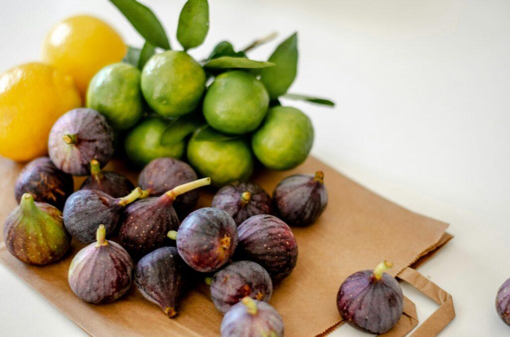 Fresh citrus and figs on the table.