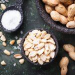 Raw peeled peanuts on bowl