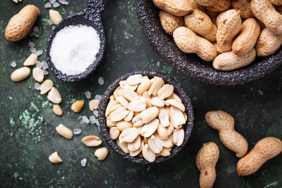 Raw peeled peanuts on bowl