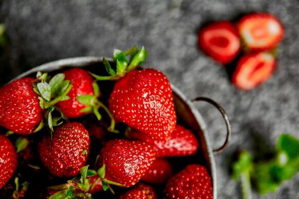 Strawberries in white basket. Fresh strawberries.